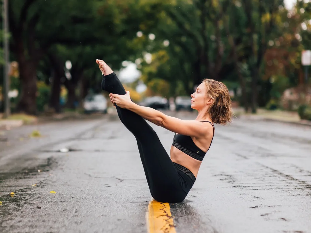 Emma in a Pilates teaser on a tree-lined street